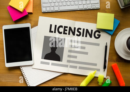 Patent License agreement LICENSING   business man hand working on laptop computer Stock Photo