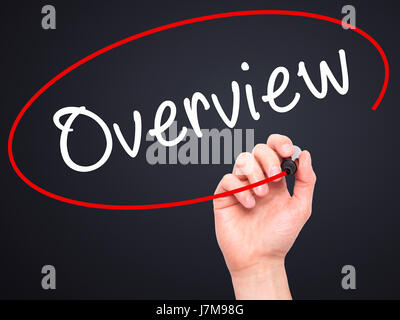 Man Hand writing Overview with black marker on visual screen. Isolated on black. Business, technology, internet concept. Stock Photo Stock Photo
