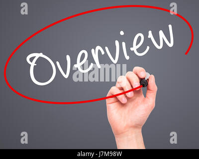 Man Hand writing Overview with black marker on visual screen. Isolated on grey. Business, technology, internet concept. Stock Photo Stock Photo