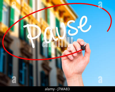 Man Hand writing Pause with black marker on visual screen. Isolated on background. Business, technology, internet concept. Stock Photo Stock Photo