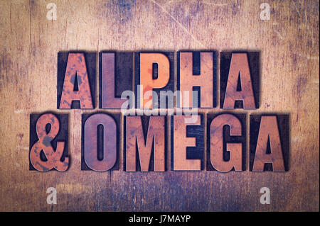 The words Alpha and Omega concept and theme written in vintage wooden letterpress type on a grunge background. Stock Photo