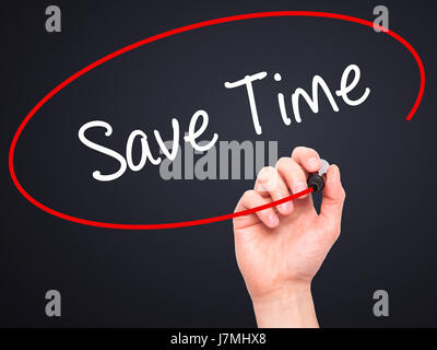 Man Hand writing Save Time with black marker on visual screen. Isolated on black. Business, technology, internet concept. Stock Photo Stock Photo