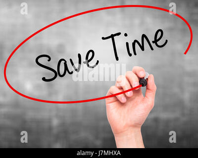 Man Hand writing Save Time with black marker on visual screen. Isolated on grey. Business, technology, internet concept. Stock Photo Stock Photo