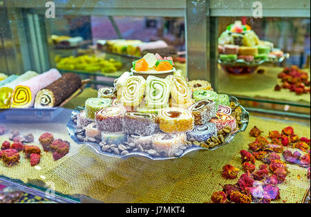 The colorful rolls of Turkish delight (rahat lokum) in showcase of the candy shop, Kemer, Turkey. Stock Photo