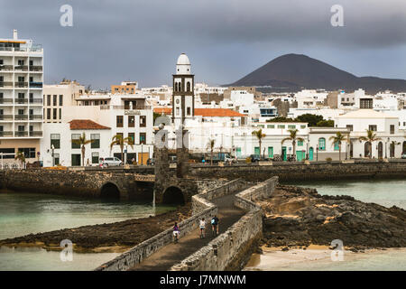 LANZAROTE - JANUARY 5: View from the Castillo de St. Gabriel to Arrecife in Lanzarote, Spain with dark clouds on January 5, 2016. Stock Photo