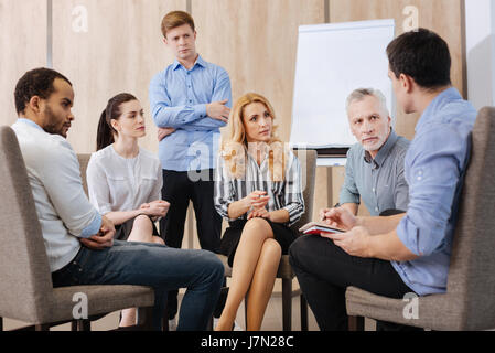 Nice pleasant people participating in the group discussion Stock Photo