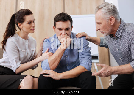 Cheerless handsome man feeling depressed Stock Photo