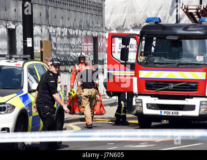 Manchester, UK. 25th May, 2017. Armed police and bomb disposal units Manchester Arena. Credit: Della Batchelor/Alamy Live News Stock Photo