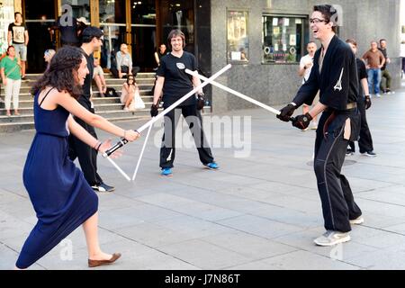 Madrid, Spain. 25th May 2017. Star Wars fans practicing the laser sword fight. May 25 is Geek Pride Day, initiative originated in Spain in 2006 as ' Dia del orgullo friki' and spread around the world via the Internet. Credit: M. Ramirez / Alamy Live News Stock Photo