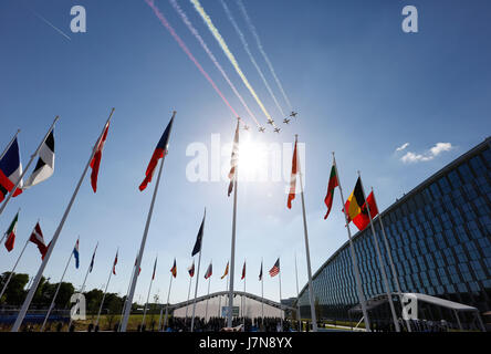 Brussels, Belgium. 25th May, 2017. Aircrafts fly over the NATO new headquarters at its handover ceremony during a one-day NATO Summit, in Brussels, Belgium, May 25, 2017. Credit: Ye Pingfan/Xinhua/Alamy Live News Stock Photo