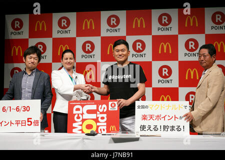 (L to R) McDonald's Japan CEO and President Sarah Casanova and Japan's online shopping giant Rakuten president Hiroshi Mikitani shake hands during a news conference on May 26, 2017, Tokyo, Japan. Rakuten and McDonald's have cemented their business relationship by launching an original point card which can be used at all of the 2,900 McDonald's stores in Japan. Credit: Rodrigo Reyes Marin/AFLO/Alamy Live News Stock Photo
