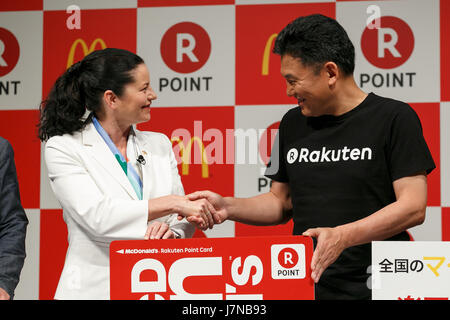 (L to R) McDonald's Japan CEO and President Sarah Casanova and Japan's online shopping giant Rakuten president Hiroshi Mikitani shake hands during a news conference on May 26, 2017, Tokyo, Japan. Rakuten and McDonald's have cemented their business relationship by launching an original point card which can be used at all of the 2,900 McDonald's stores in Japan. Credit: Rodrigo Reyes Marin/AFLO/Alamy Live News Stock Photo