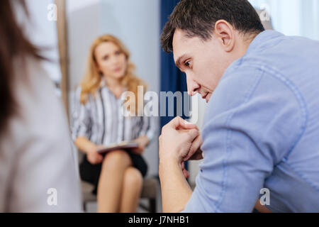 Handsome nice man feeling stressed out Stock Photo