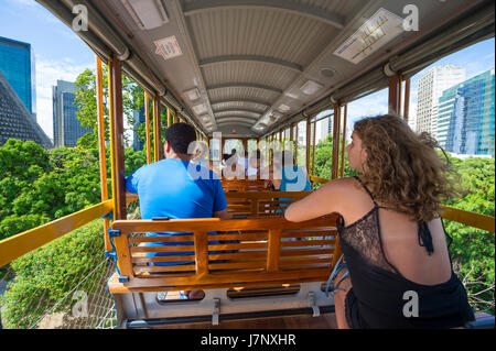 RIO DE JANEIRO - JANUARY 31, 2017: Passengers ride the tram to Santa Teresa, a service gradually being reinstated after an accident in 2011. Stock Photo