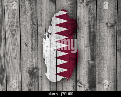 Map and flag of Qatar on weathered wood Stock Photo