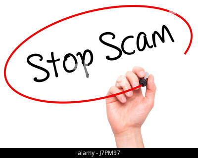Man Hand writing Stop Scam with black marker on visual screen. Isolated on background. Business, technology, internet concept. Stock Photo Stock Photo