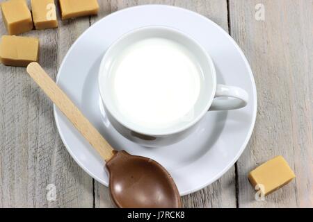 milk being prepared for a hot chocolate with caramel flavor Stock Photo