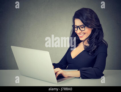 Happy smiling woman working with laptop Stock Photo