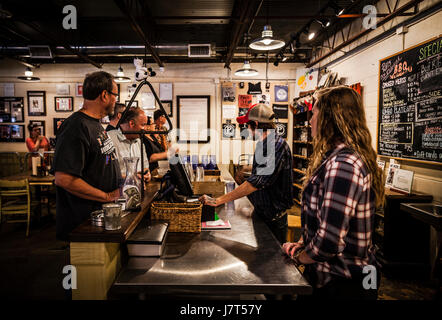 People waiting to pay the cashier at Pecan Lodge, Deep Ellum, Dallas, Texas Stock Photo