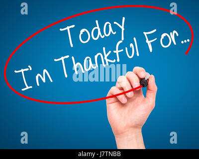 Man Hand writing Today I'm Thankful For... with black marker on visual screen. Isolated on blue. Life, technology, internet concept. Stock Image Stock Photo