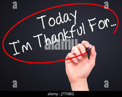 Man Hand writing Today I'm Thankful For... with black marker on visual screen. Isolated on black. Life, technology, internet concept. Stock Image Stock Photo