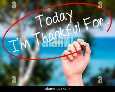Man Hand writing Today I'm Thankful For... with black marker on visual screen. Isolated on nature. Life, technology, internet concept. Stock Image Stock Photo