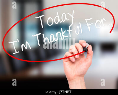 Man Hand writing Today I'm Thankful For... with black marker on visual screen. Isolated on office. Life, technology, internet concept. Stock Image Stock Photo