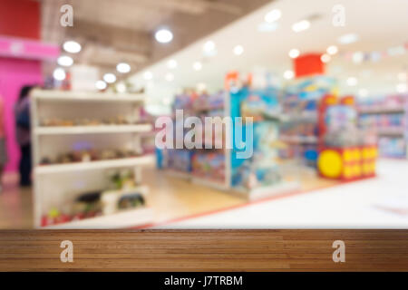 Wooden floor with Toy Department blurred background. Stock Photo