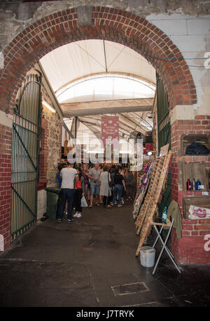 Fremantle,WA,Australia-November 13,2016: People, brick archway with gate and market stalls at the Fremantle Markets in Fremantle, Western Australia. Stock Photo