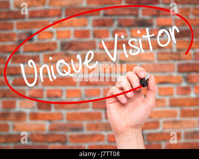 Man Hand writing Unique Visitor with black marker on visual screen. Isolated on background. Business, technology, internet concept. Stock Photo Stock Photo