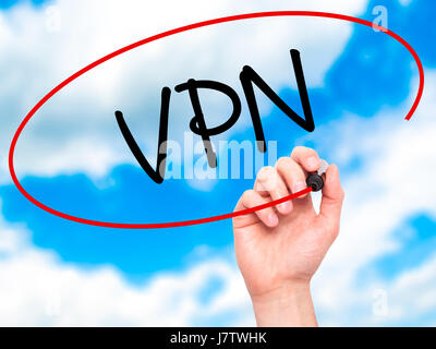 Man Hand writing VPN (Virtual Private Network) with black marker on visual screen. Isolated on background. Business, technology, internet concept. Sto Stock Photo