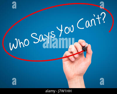 Man Hand writing Who Says You Cant? with black marker on visual screen. Isolated on background. Business, technology, internet concept. Stock  Photo Stock Photo