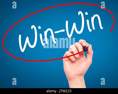 Man Hand writing Win-Win with black marker on visual screen. Isolated on background. Business, technology, internet concept. Stock  Photo Stock Photo