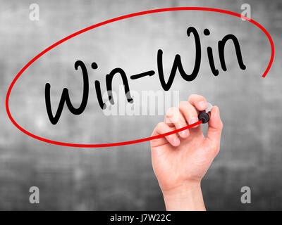 Man Hand writing Win-Win with black marker on visual screen. Isolated on background. Business, technology, internet concept. Stock  Photo Stock Photo