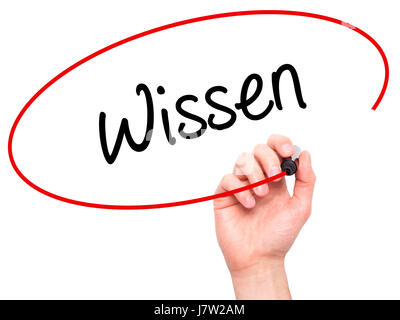 Man Hand writing Wissen (Know in German)  with black marker on visual screen. Isolated on background. Business, technology, internet concept. Stock Ph Stock Photo