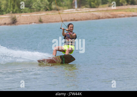 Woman study wakeboarding on a blue lake summer sports Stock Photo