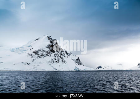 Snow capped mountain in Antarctica Stock Photo