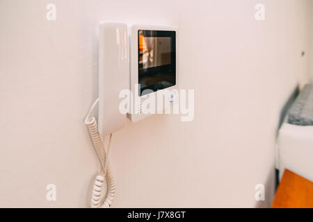 Intercom in the apartment. Intercom hanging on the wall. Interco Stock Photo