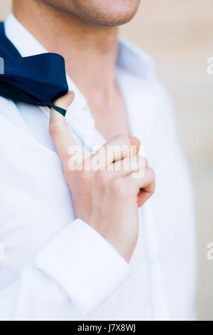 The jacket on the man is close-up. The bridegroom at the wedding Stock Photo