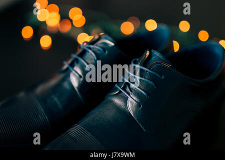 Black man's shoes with laces. Against background bokeh. Stock Photo