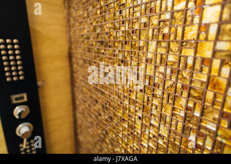 The texture of the small tile mosaic is brown with sparkles in Stock Photo