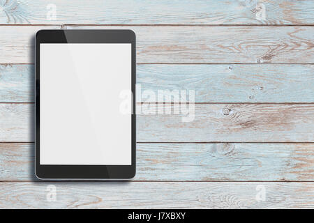 Black tablet pc on old wood table background Stock Photo