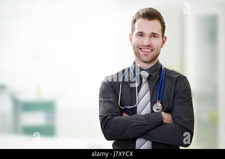 Handsome young doctor in office. Healthcare and medicine concept Stock Photo