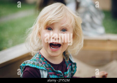 Young blond girl crying and screaming. Stock Photo