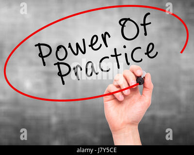 Man Hand writing Power Of Practice with black marker on visual screen. Isolated on grey. Business, technology, internet concept. Stock Image Stock Photo