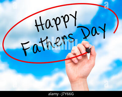 Man Hand writing Happy Fathers Day with black marker on visual screen. Isolated on sky. Business, technology, internet concept. Stock Image Stock Photo