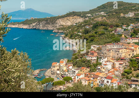 Coastline and village on the Sorrento Peninsula, and the Mount Vesuvius in the background Stock Photo