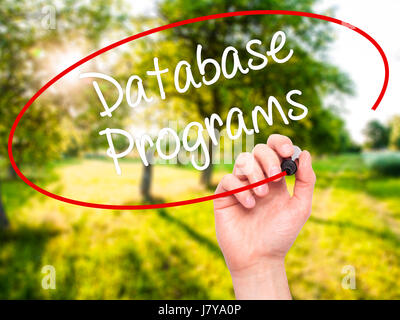 Man Hand writing Database Programs with black marker on visual screen. Isolated on background. Business, technology, internet concept. Stock Photo Stock Photo