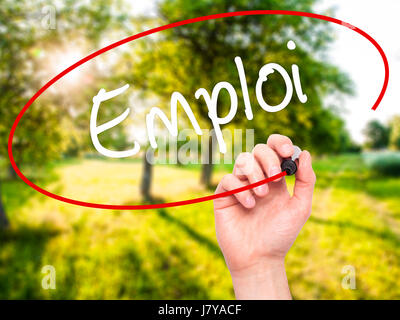 Man Hand writing Emploi (Employment in French) with black marker on visual screen. Isolated on background. Business, technology, internet concept. Sto Stock Photo