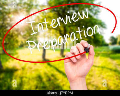 Man Hand writing Interview Preparation with black marker on visual screen. Isolated on nature. Business, technology, internet concept. Stock Photo Stock Photo